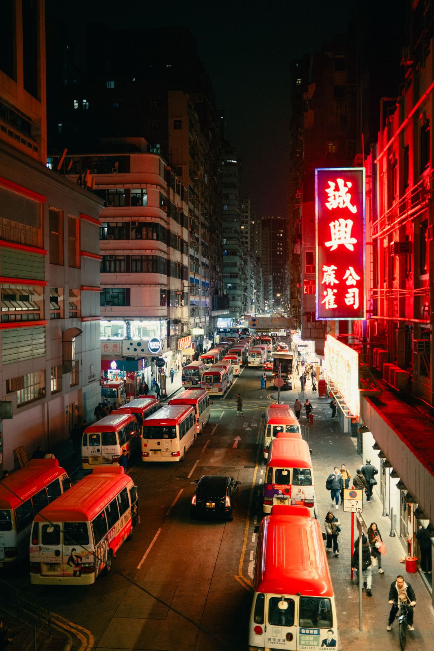 A vivid neon-lit street at night, by Nate Tran